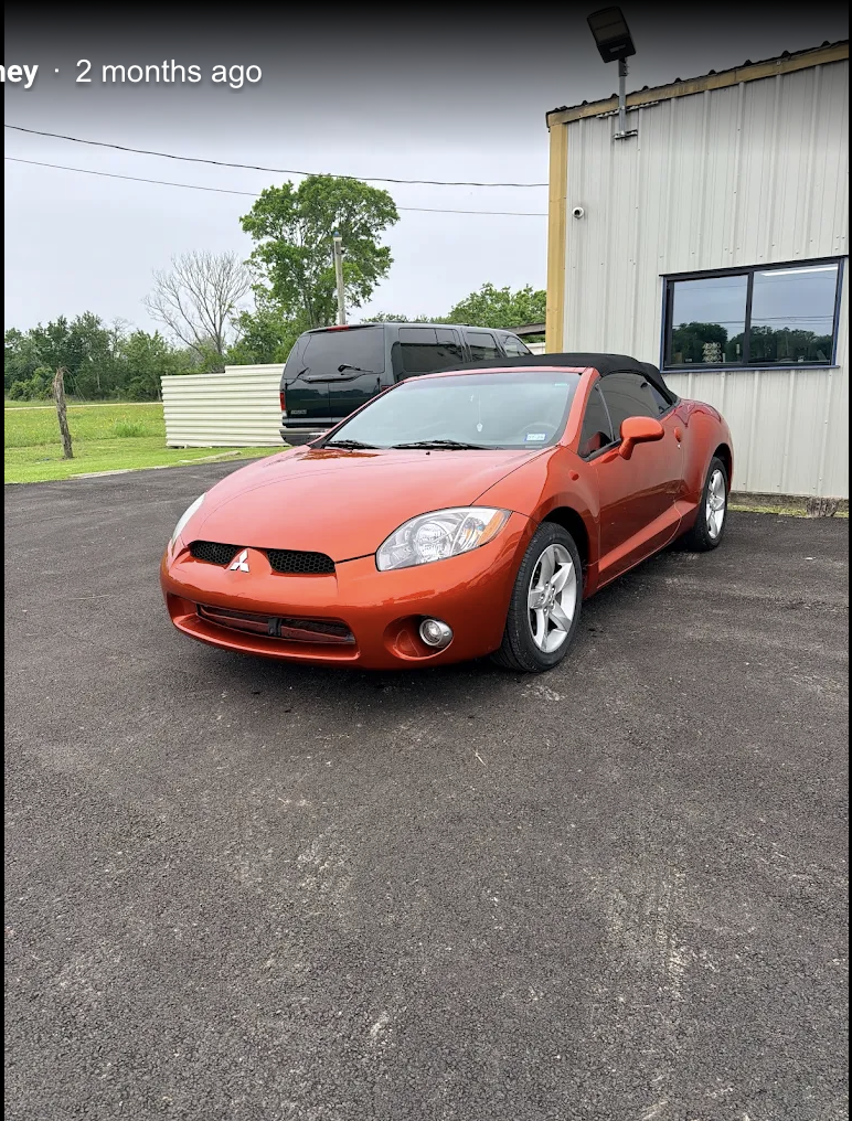 Mitsubishi Eclipse Spyder after repair at George's Paint & Body Shop